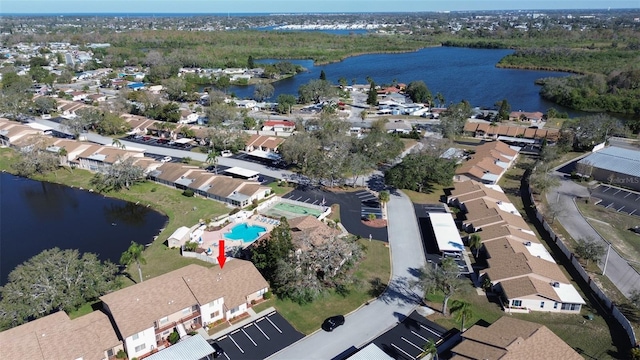 birds eye view of property with a residential view and a water view