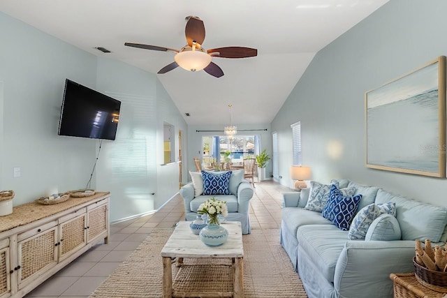 living room with light tile patterned floors, lofted ceiling, visible vents, baseboards, and a ceiling fan