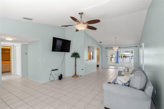 living room with light tile patterned floors, visible vents, baseboards, ceiling fan, and vaulted ceiling