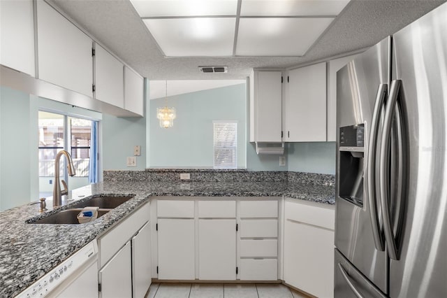 kitchen with stainless steel fridge, visible vents, dishwasher, a sink, and light tile patterned flooring