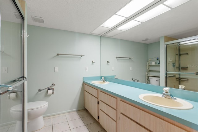 full bathroom featuring visible vents, a sink, toilet, and tile patterned floors