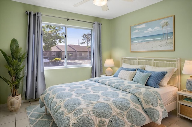 bedroom featuring a ceiling fan and tile patterned floors