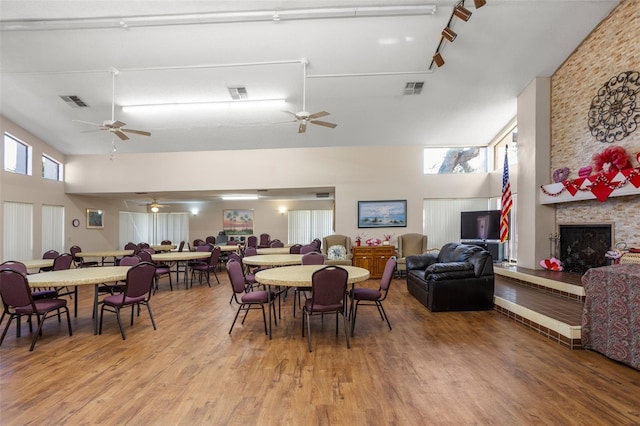 dining space featuring light wood-style floors, plenty of natural light, and visible vents