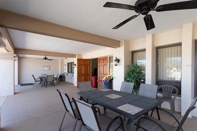 view of patio / terrace with outdoor dining area and a ceiling fan