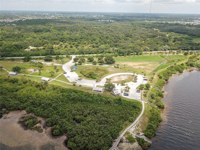 aerial view featuring a water view and a view of trees