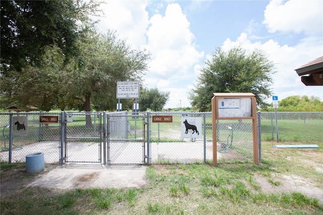 view of gate featuring fence