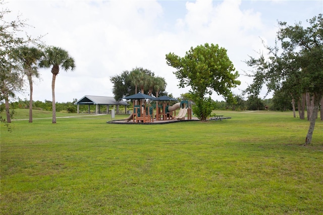 communal playground with a yard and a gazebo