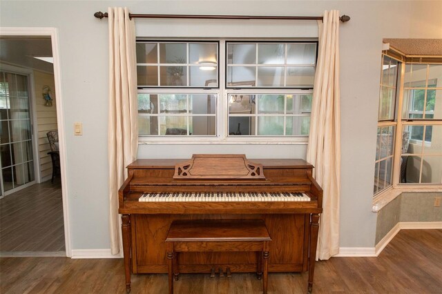 room details featuring baseboards and wood finished floors