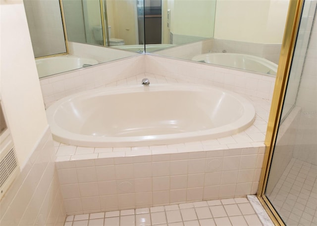 bathroom featuring toilet, a stall shower, and a bath