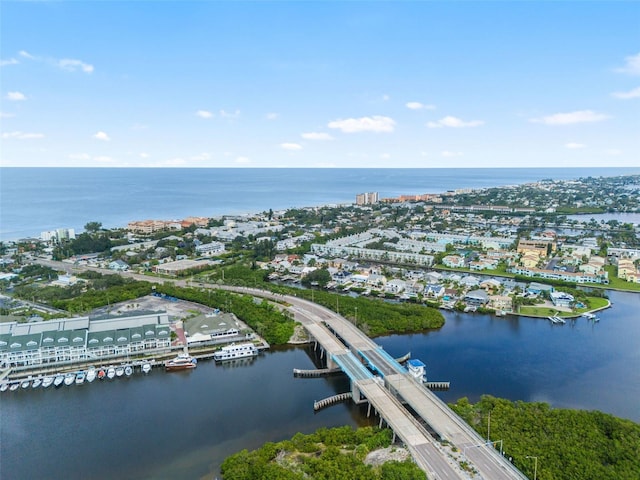 drone / aerial view featuring a water view and a view of city