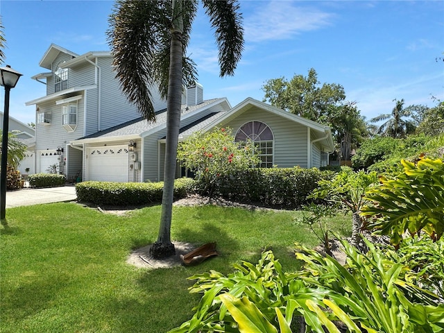 11722 Currie Ln Unit G1, Largo, FL 33774 - view of front of home featuring a front lawn, driveway, and an attached garage