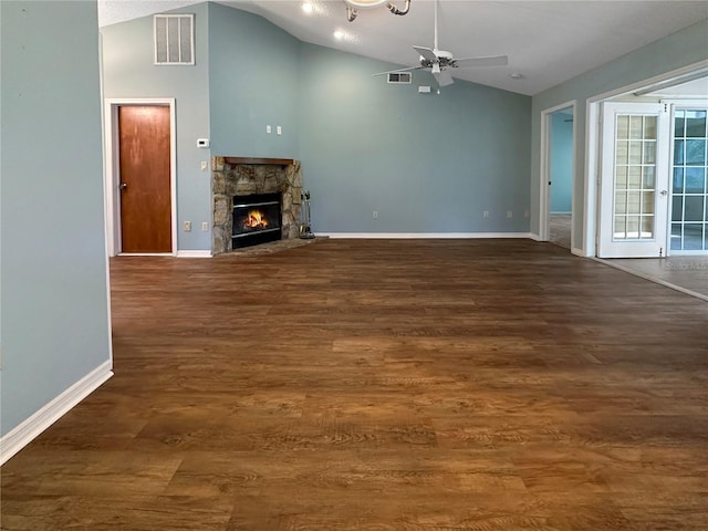 11722 Currie Ln Unit G1, Largo, FL 33774 - unfurnished living room with lofted ceiling, a fireplace, ceiling fan, and wood finished floors
