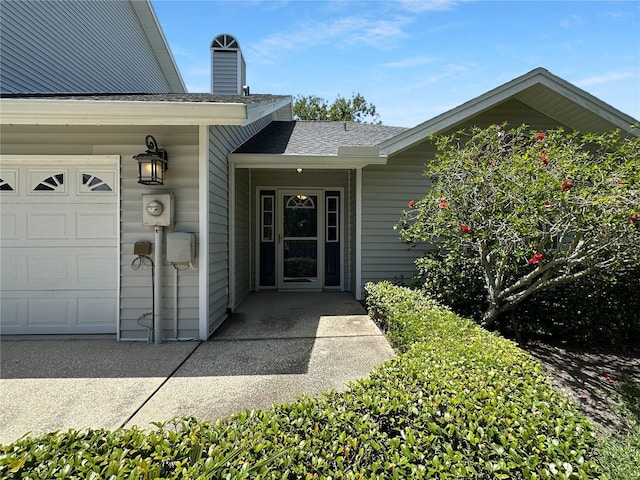 11722 Currie Ln Unit G1, Largo, FL 33774 - property entrance with a shingled roof and an attached garage