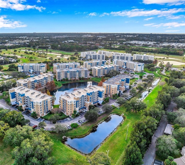 bird's eye view featuring a water view and a city view