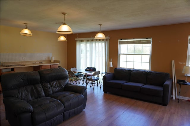 living room with wood finished floors and baseboards