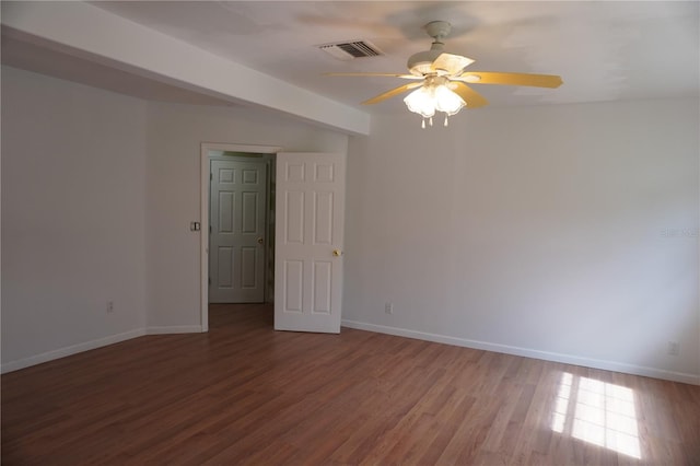 unfurnished room with a ceiling fan, baseboards, and wood finished floors