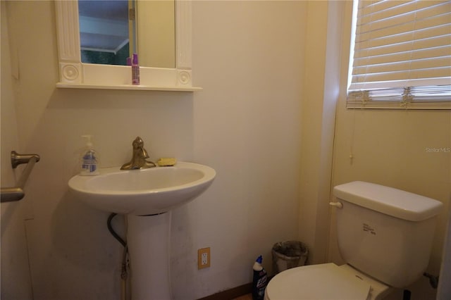 half bath featuring toilet