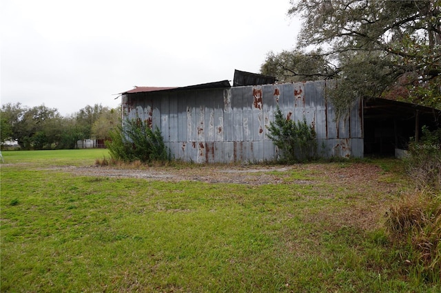 exterior space with a pole building and an outbuilding