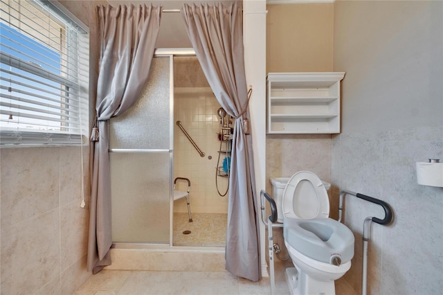 bathroom with toilet, a stall shower, a bidet, and tile patterned floors