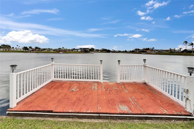 dock area with a deck with water view