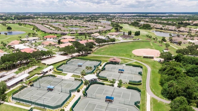 bird's eye view with a water view and golf course view