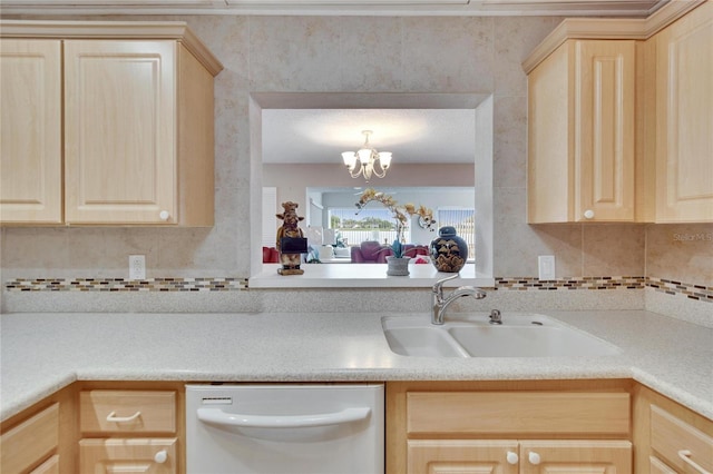 kitchen with a sink, light brown cabinets, light countertops, and dishwasher