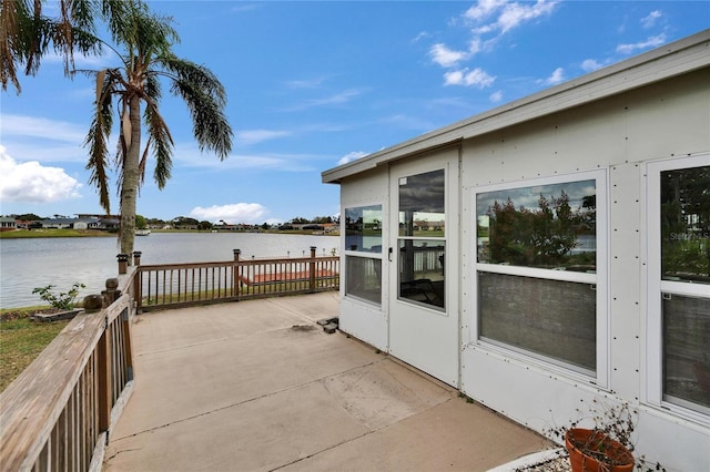 view of patio featuring a water view