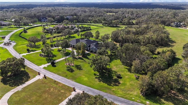 bird's eye view featuring a wooded view