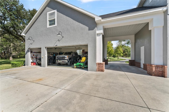 garage with concrete driveway