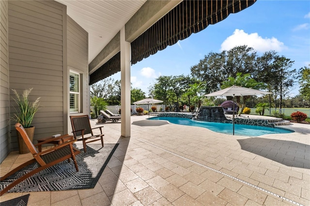 view of swimming pool with a patio area, a fenced in pool, and a jacuzzi