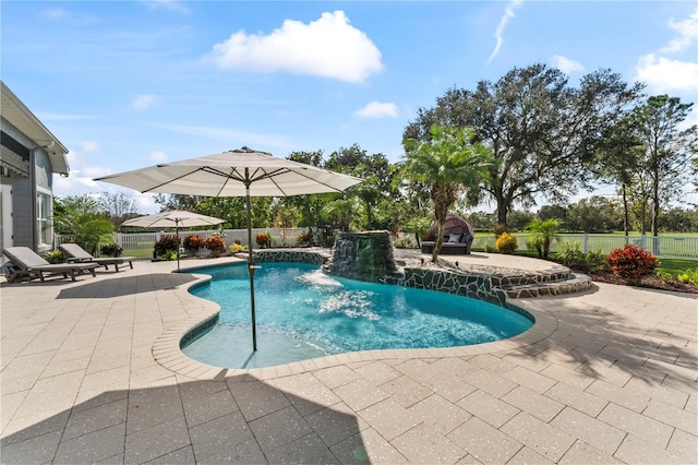 view of swimming pool featuring a fenced in pool, a patio area, and fence