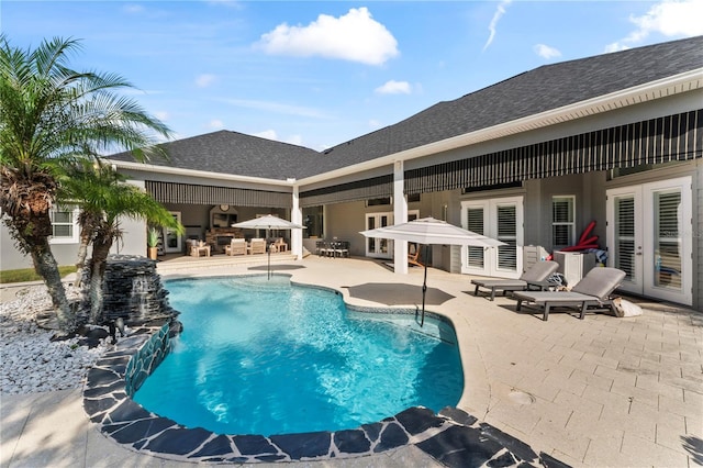 pool featuring a patio and french doors