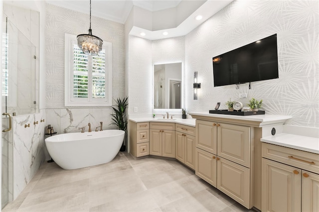 bathroom featuring vanity, a soaking tub, wallpapered walls, a stall shower, and crown molding