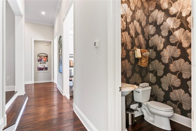 interior space featuring crown molding, dark wood-style flooring, recessed lighting, and baseboards