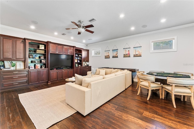 living room with visible vents, a ceiling fan, ornamental molding, dark wood-style flooring, and recessed lighting