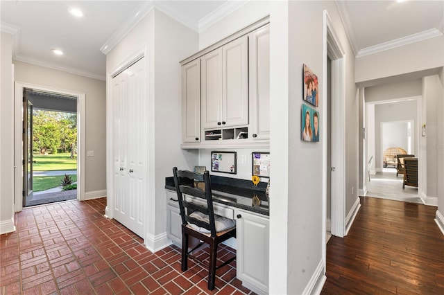 home office featuring brick floor, recessed lighting, crown molding, and baseboards