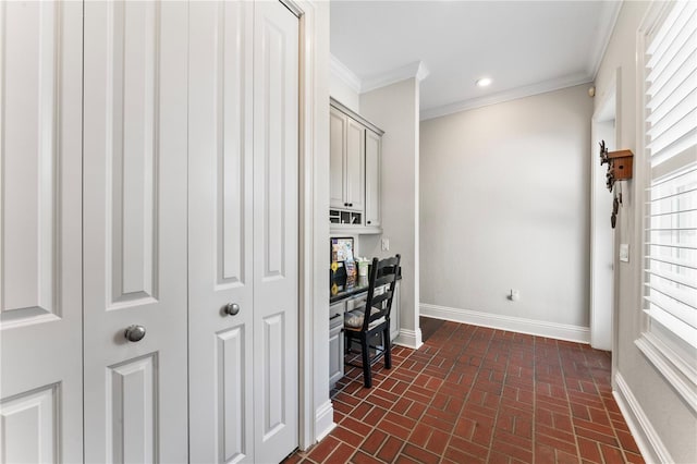 office area with brick floor, baseboards, crown molding, and recessed lighting