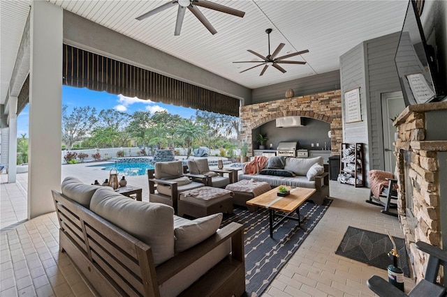 view of patio with a fenced in pool, area for grilling, and an outdoor living space with a fireplace