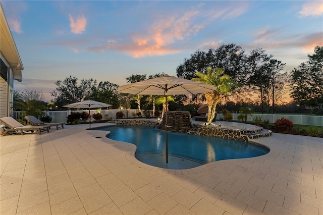 view of swimming pool featuring a fenced backyard, a fenced in pool, and a patio