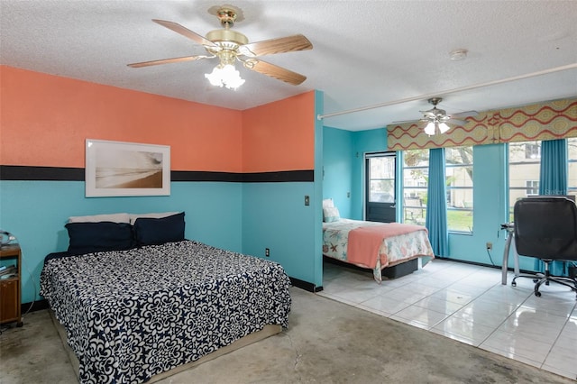 bedroom featuring a ceiling fan and a textured ceiling