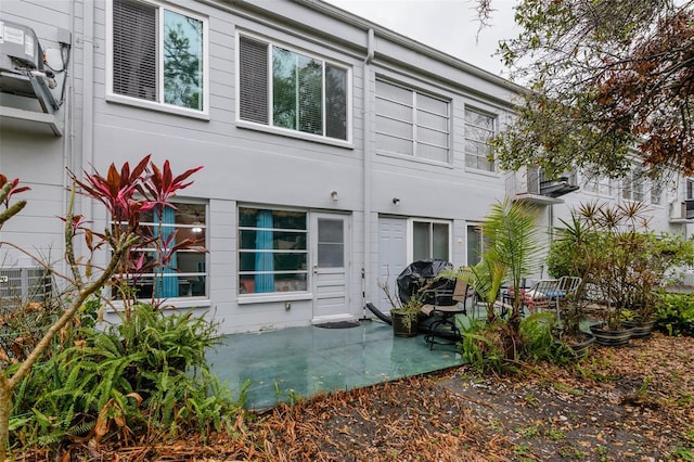 rear view of property featuring a patio