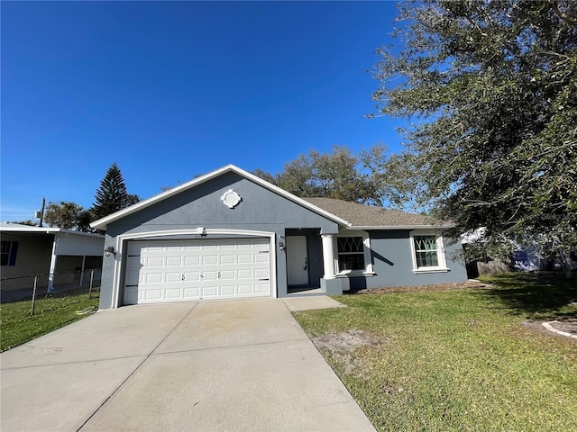 ranch-style home with stucco siding, concrete driveway, an attached garage, a front yard, and fence