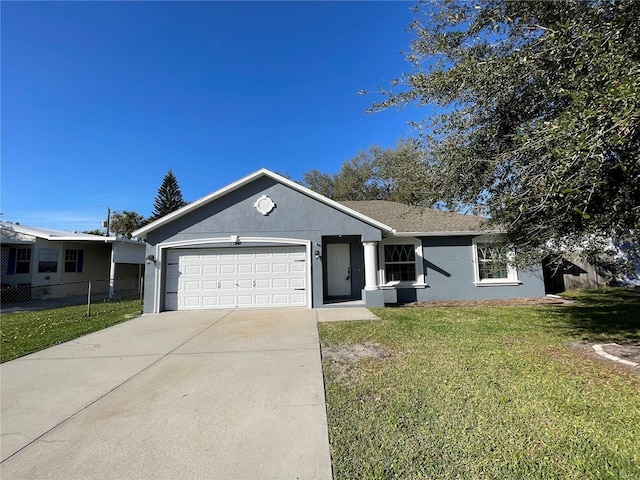 ranch-style house with a garage, a front yard, fence, and stucco siding