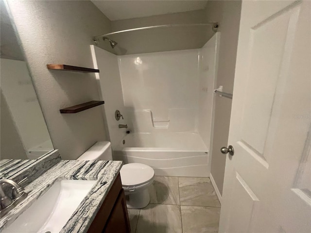 bathroom featuring toilet, vanity,  shower combination, and marble look tile flooring