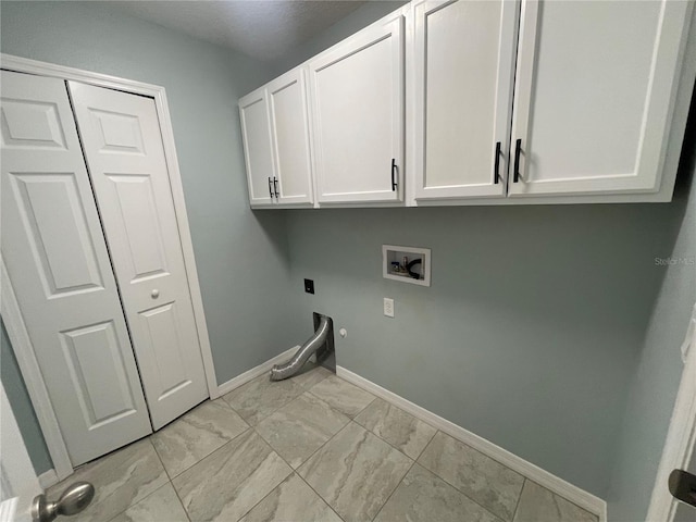 laundry area with cabinet space, hookup for a washing machine, baseboards, hookup for an electric dryer, and hookup for a gas dryer