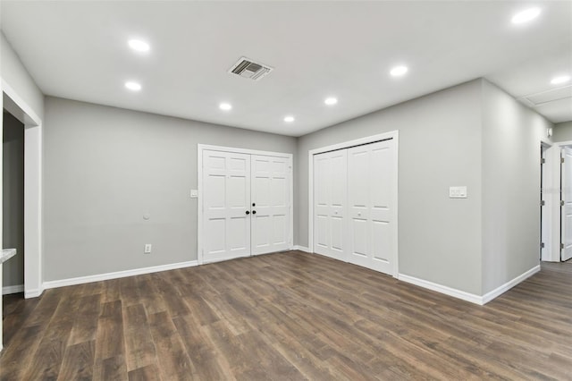 interior space with visible vents, dark wood-style flooring, and recessed lighting