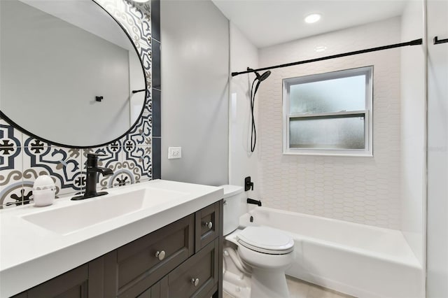 full bathroom with toilet, vanity, and shower / tub combination