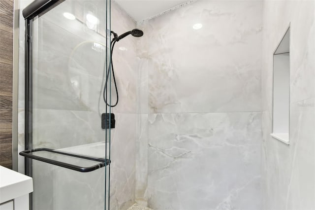 bathroom with a shower stall