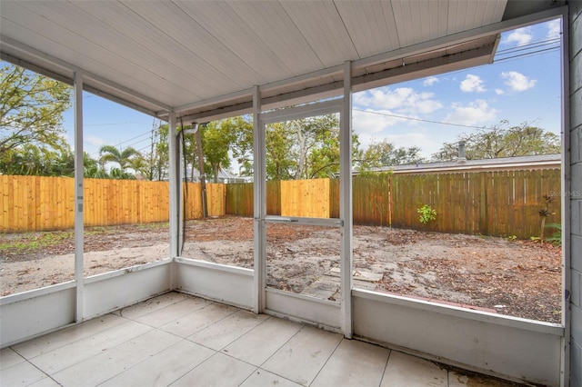 unfurnished sunroom featuring a wealth of natural light