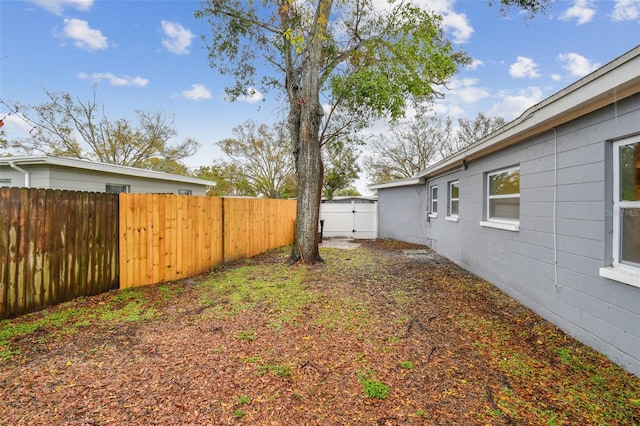 view of yard with a fenced backyard